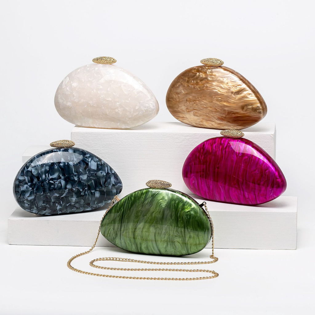 Set of five colorful clutch bags on a white background