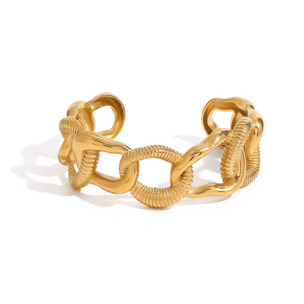 Gold chain-style bracelet on a white background