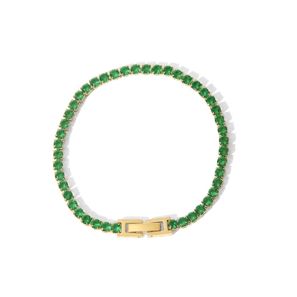 Green gemstone bracelet with gold clasp on a white background