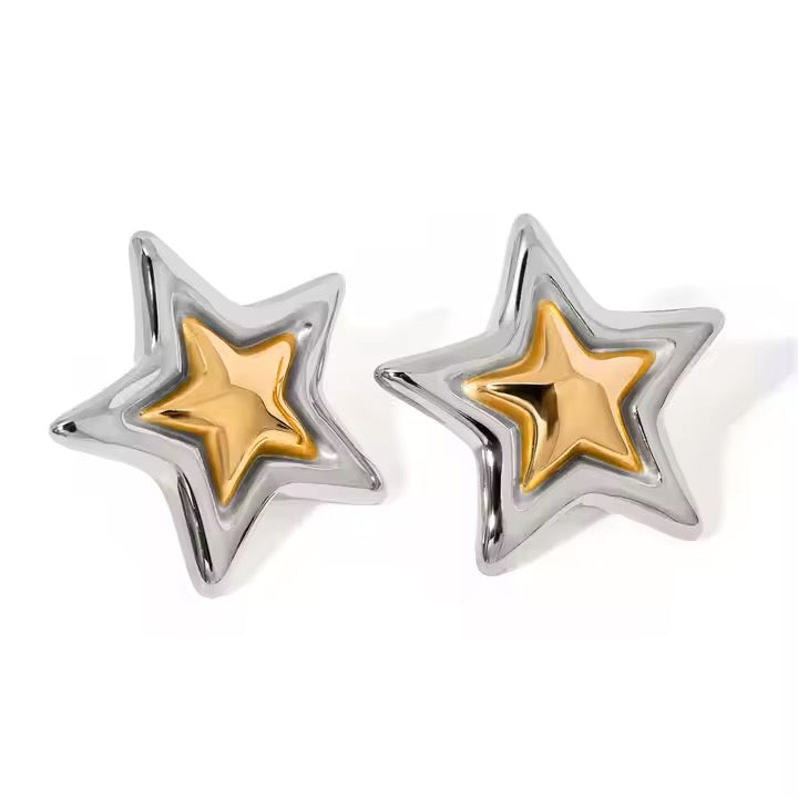 Star-shaped earrings with gold and silver finish on a white background