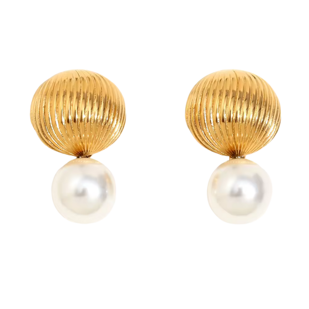 Gold earrings with pearl drops on a white background