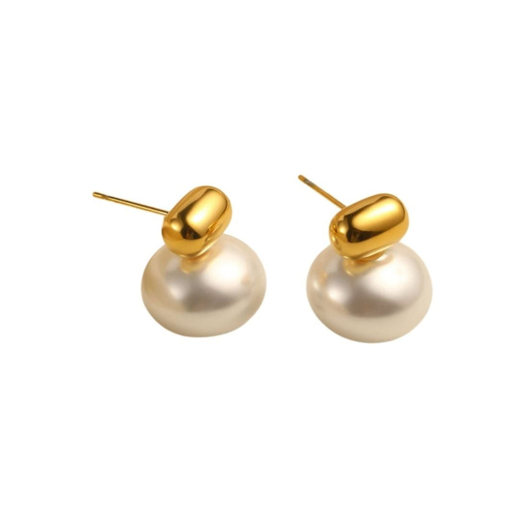 Pair of pearl earrings with gold tops on a white background